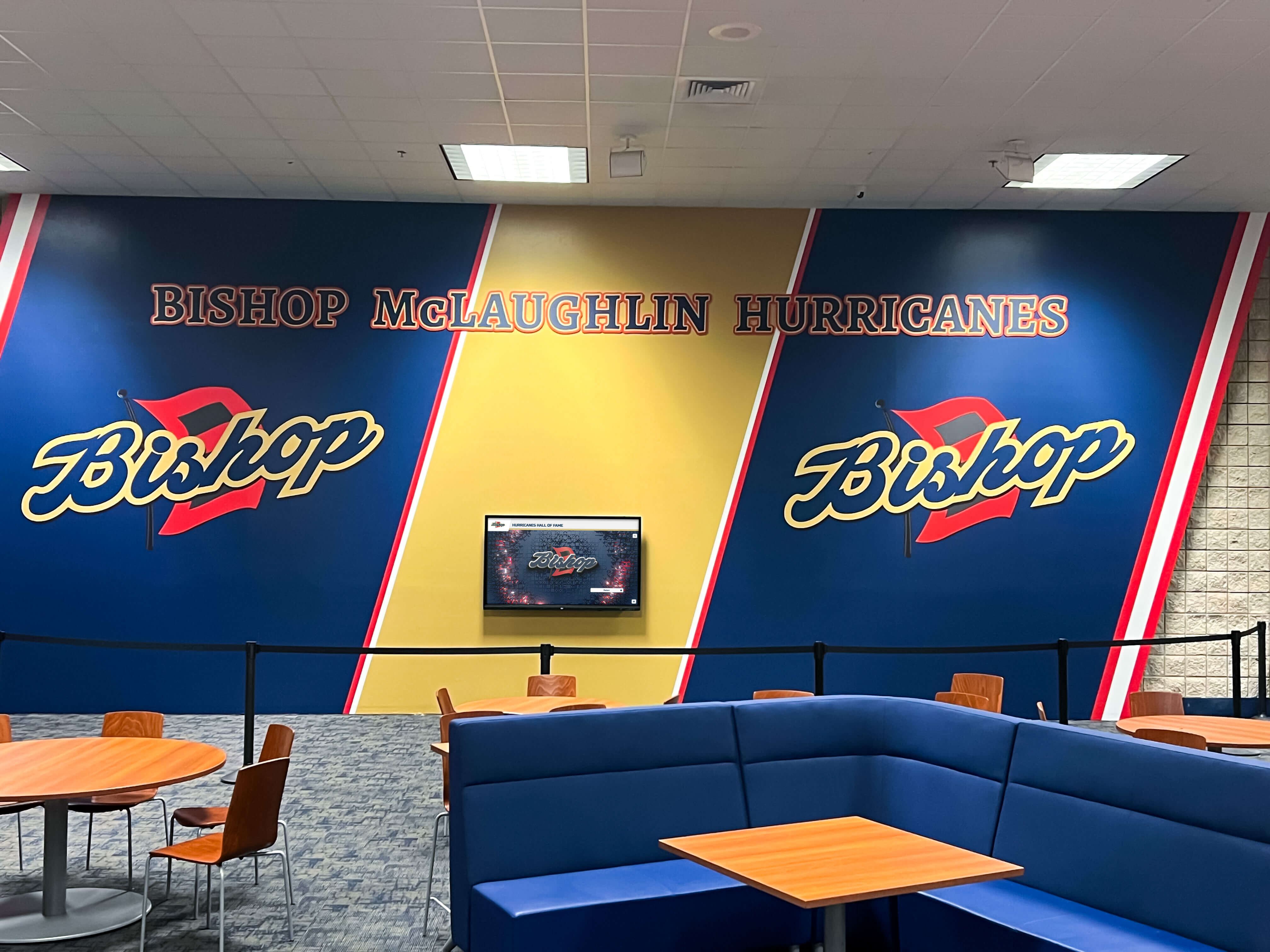 Athletic facility cafeteria lounge with team mural