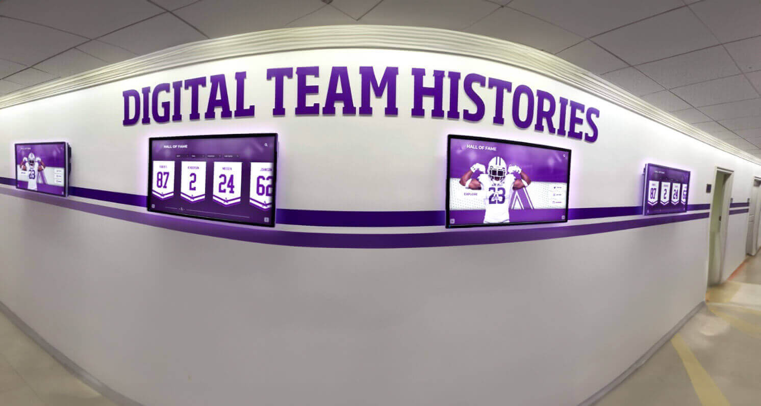 Multiple digital displays showcasing team histories Digital athletic display in hallway