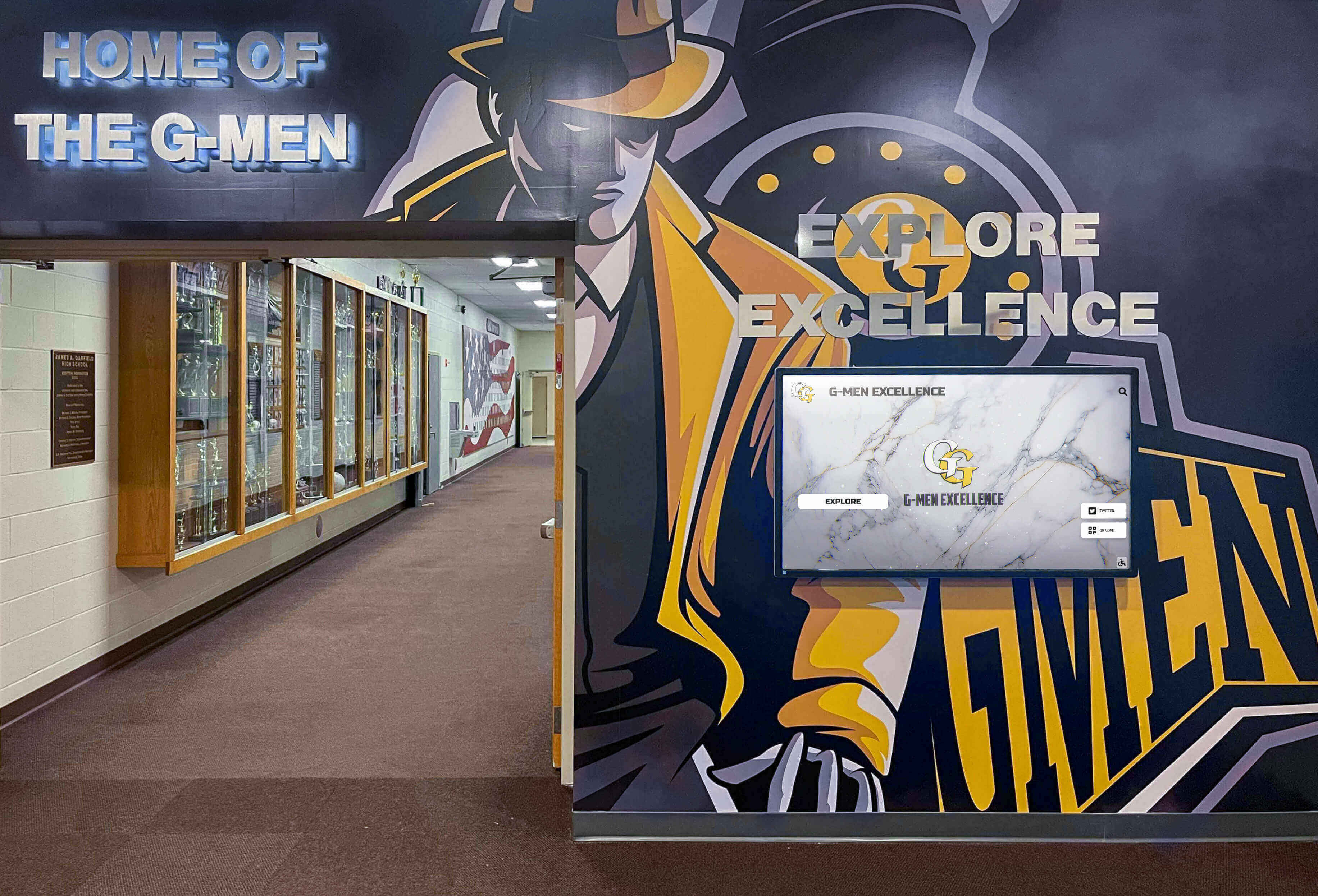 Athletic hallway with G-Men mural and trophy cases